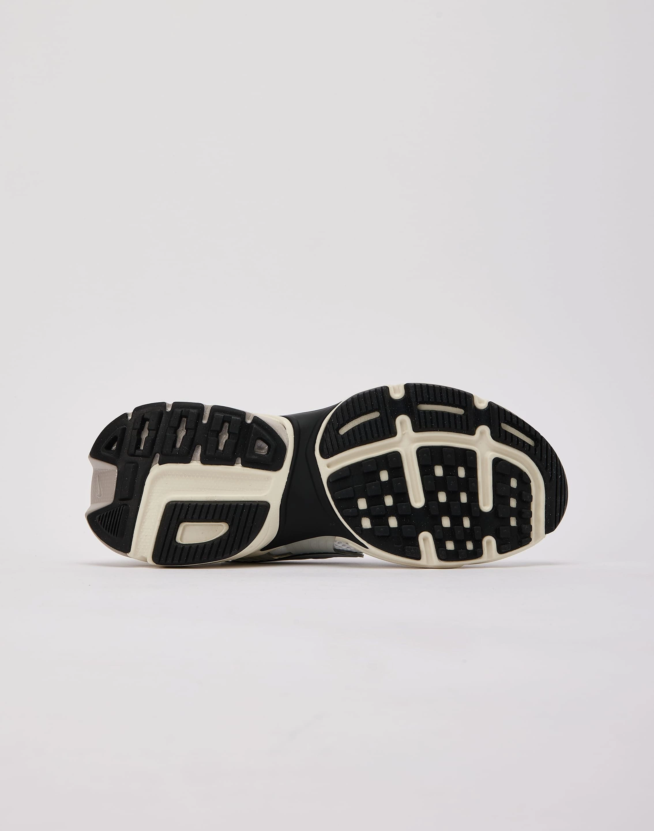 running in a Pilates studio shoes running in a beam bridge area shoes Nike V2K Run