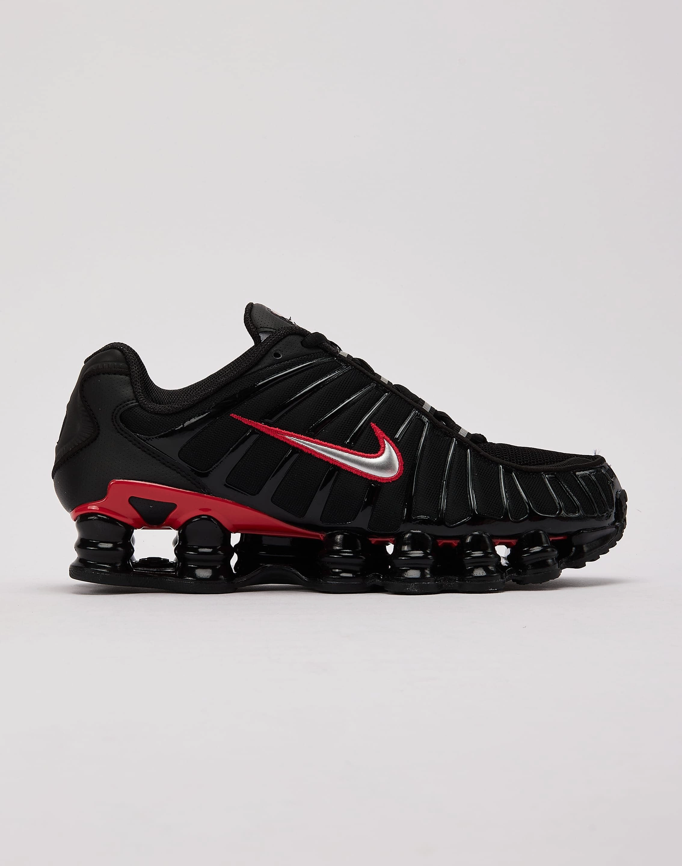 bright - colored running shoes Nike Shox TL