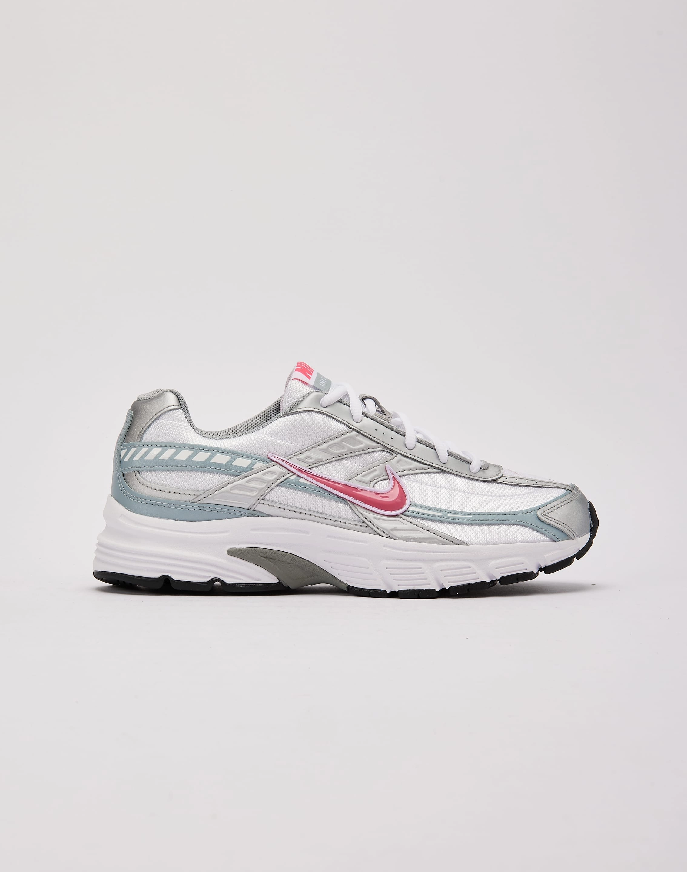 cold - weather - runner running in poorly - maintained tracks shoes Nike Initiator