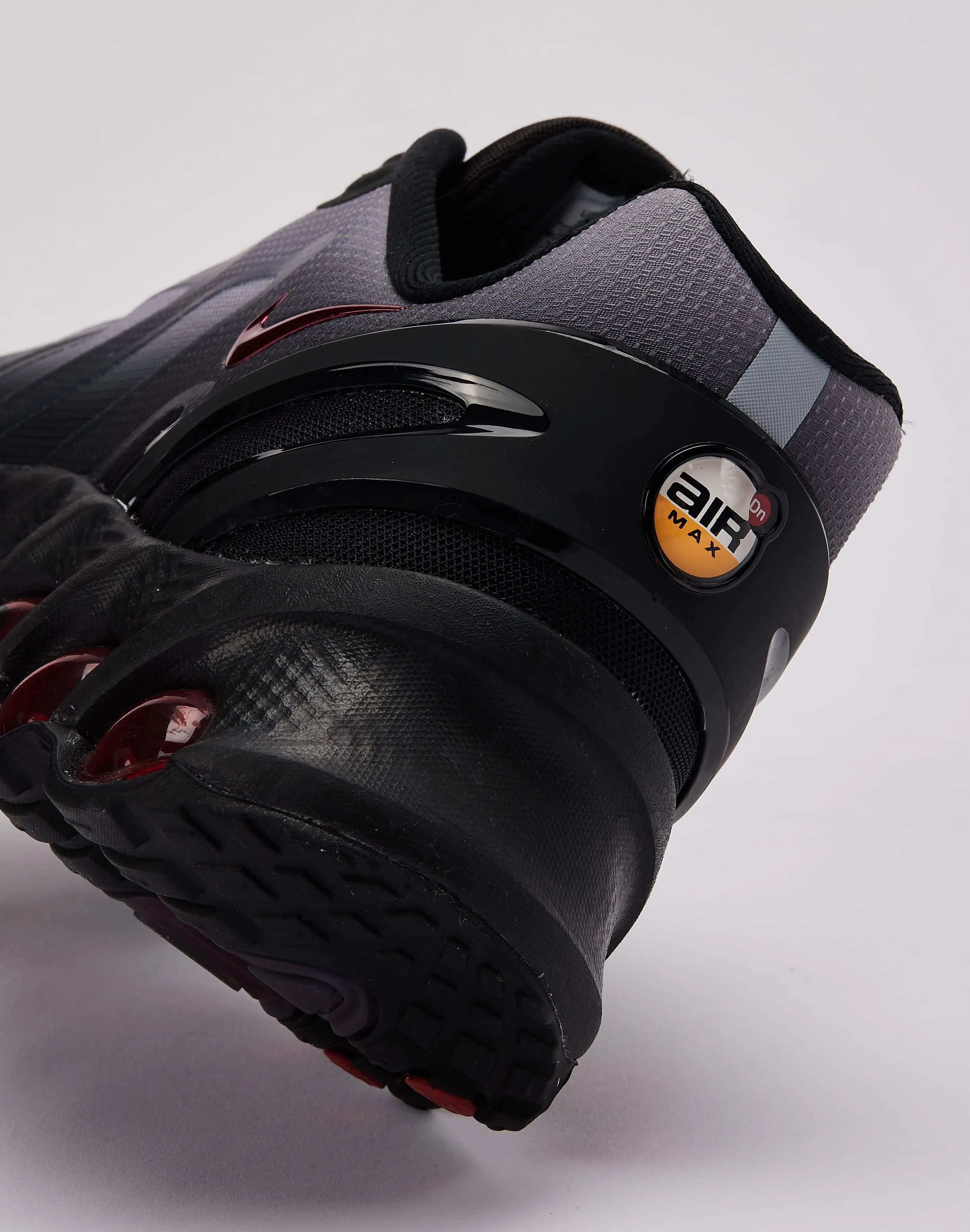 running in a sports complex shoes Nike Air Max Dn8